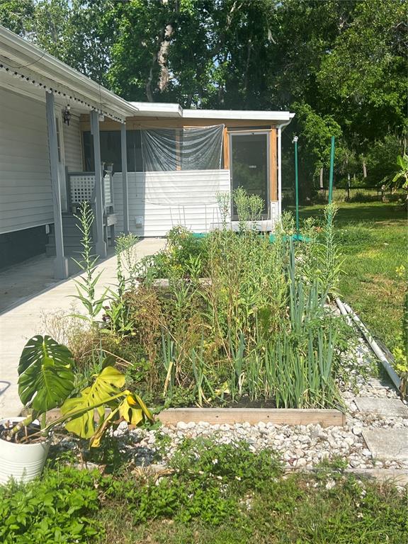 5855 Jack Brack Road St. Cloud, FL 34771 - Photo 27 of 86 a backyard of a house with lots of green space