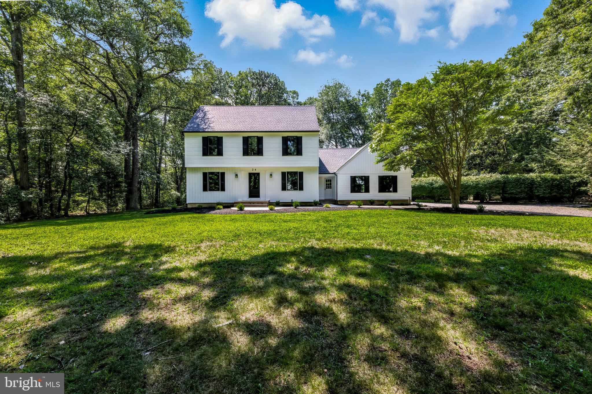 24 Muskingum Drive Shamong, NJ 08088 - Photo 1 of 24 a view of a house with a big yard and large trees