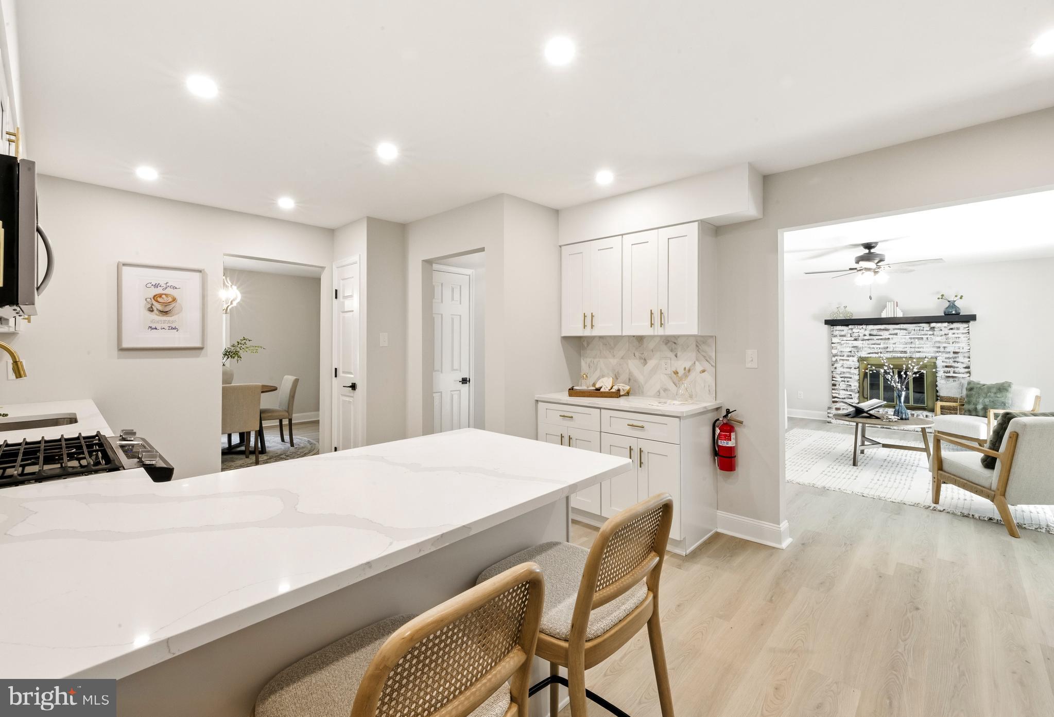 24 Muskingum Drive Shamong, NJ 08088 - Photo 12 of 24 a kitchen with kitchen island a stove a sink a refrigerator and cabinets