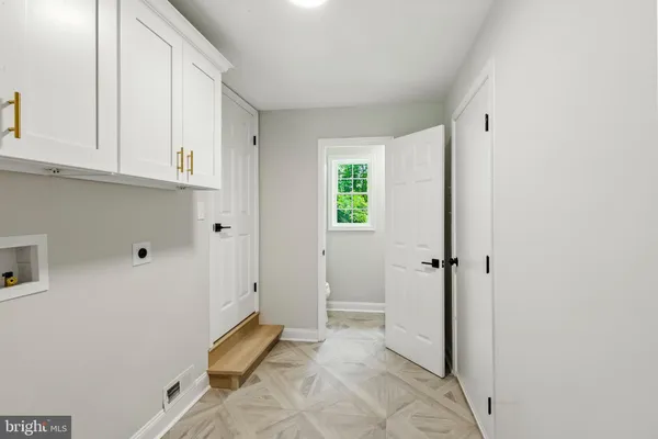 a view of room with window and hallway