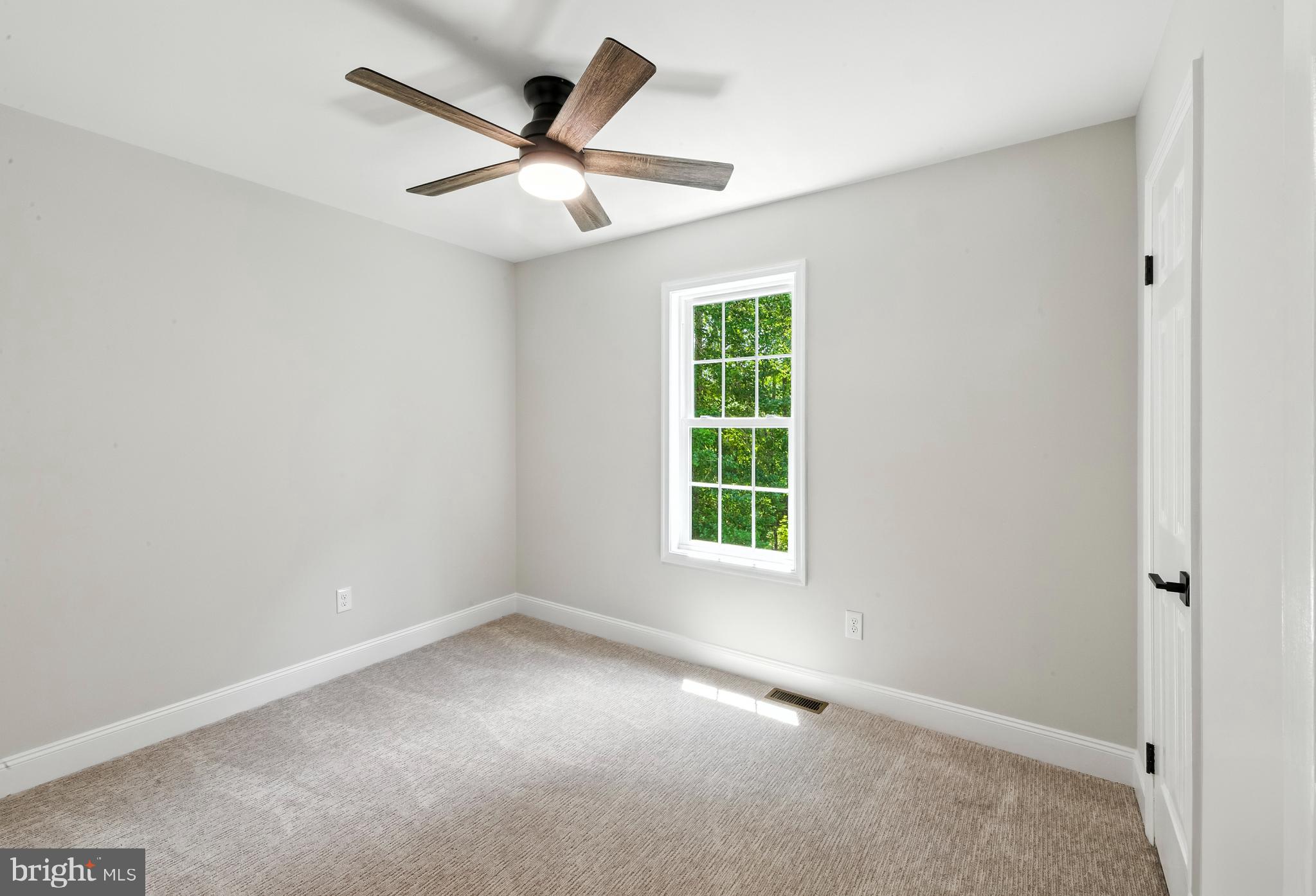 24 Muskingum Drive Shamong, NJ 08088 - Photo 19 of 24 an empty room with a window and a fan
