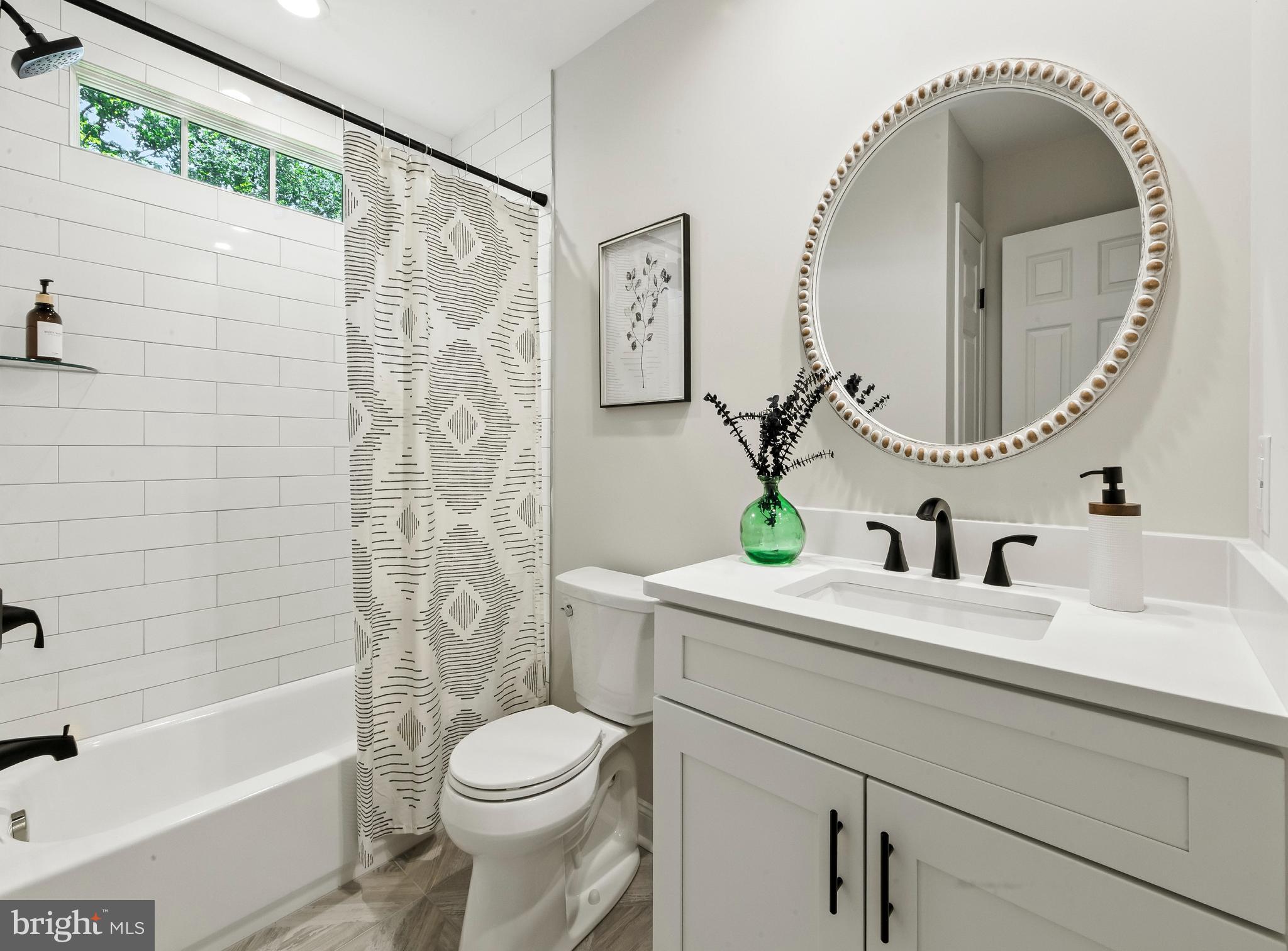 24 Muskingum Drive Shamong, NJ 08088 - Photo 20 of 24 a bathroom with a sink mirror toilet and bathtub