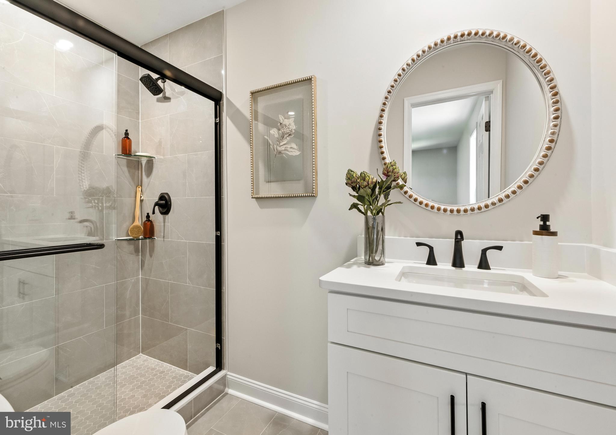24 Muskingum Drive Shamong, NJ 08088 - Photo 23 of 24 a bathroom with a sink and a mirror