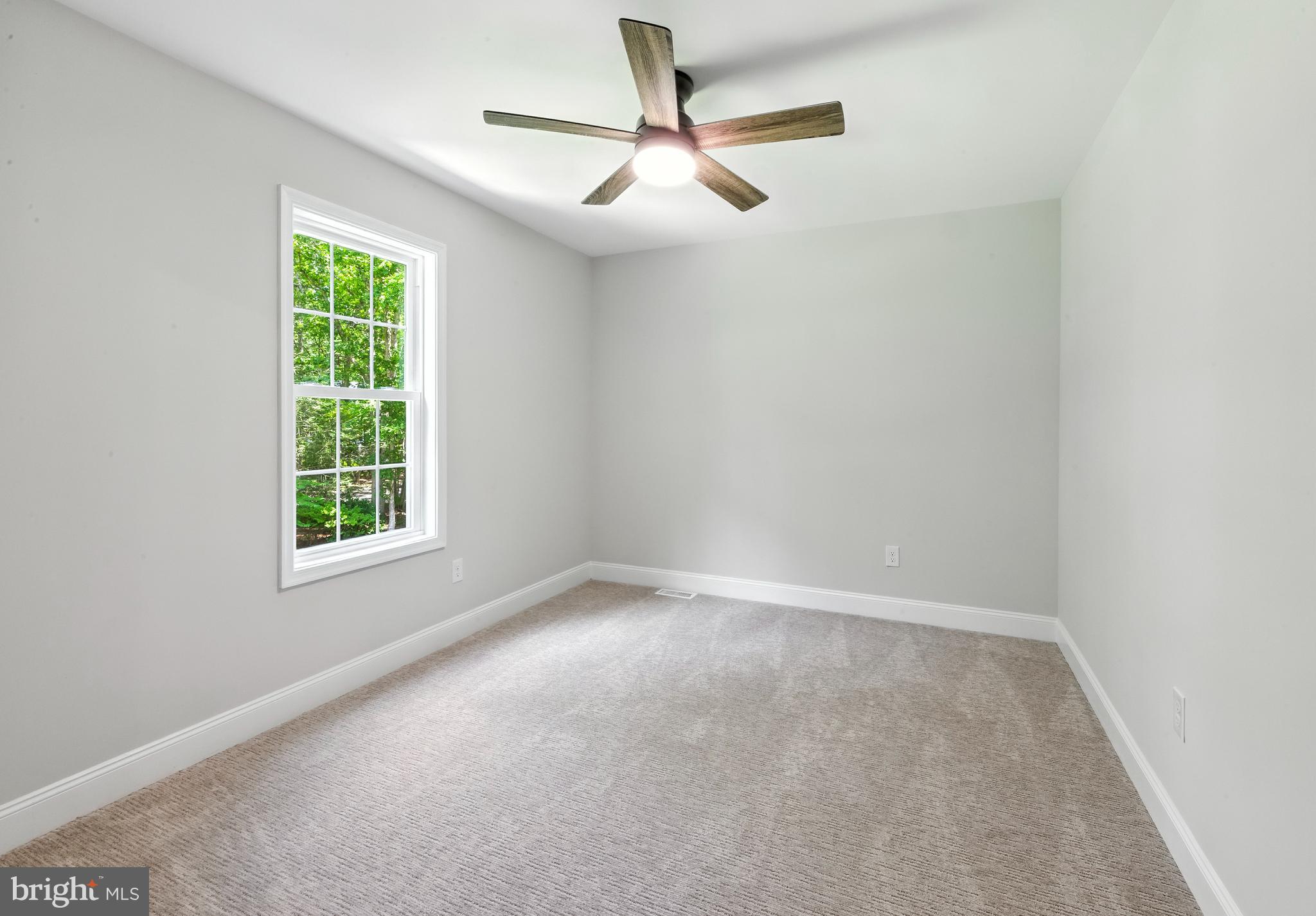 24 Muskingum Drive Shamong, NJ 08088 - Photo 24 of 24 an empty room with a window and a fan