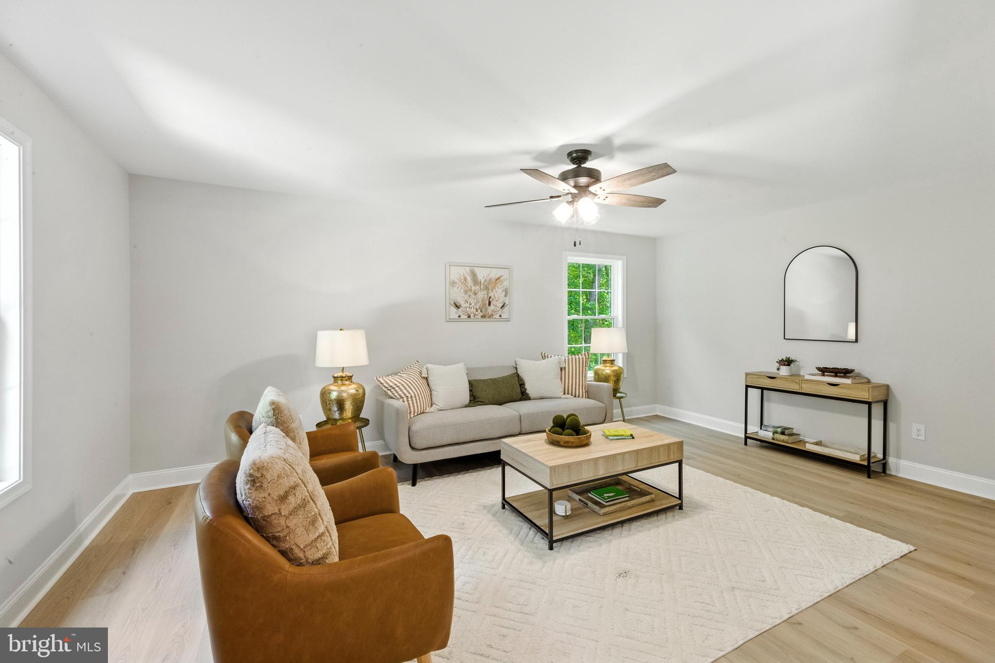 24 Muskingum Drive Shamong, NJ 08088 - Photo 5 of 24 a living room with furniture a rug and a chandelier