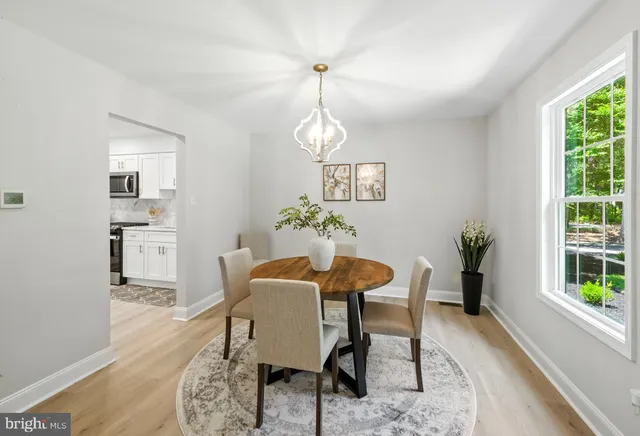 a dining room with furniture and window