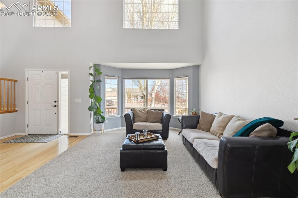 8518 Bohleen Road Peyton, CO 80831 - Photo 11 of 44 a living room with furniture and a large window