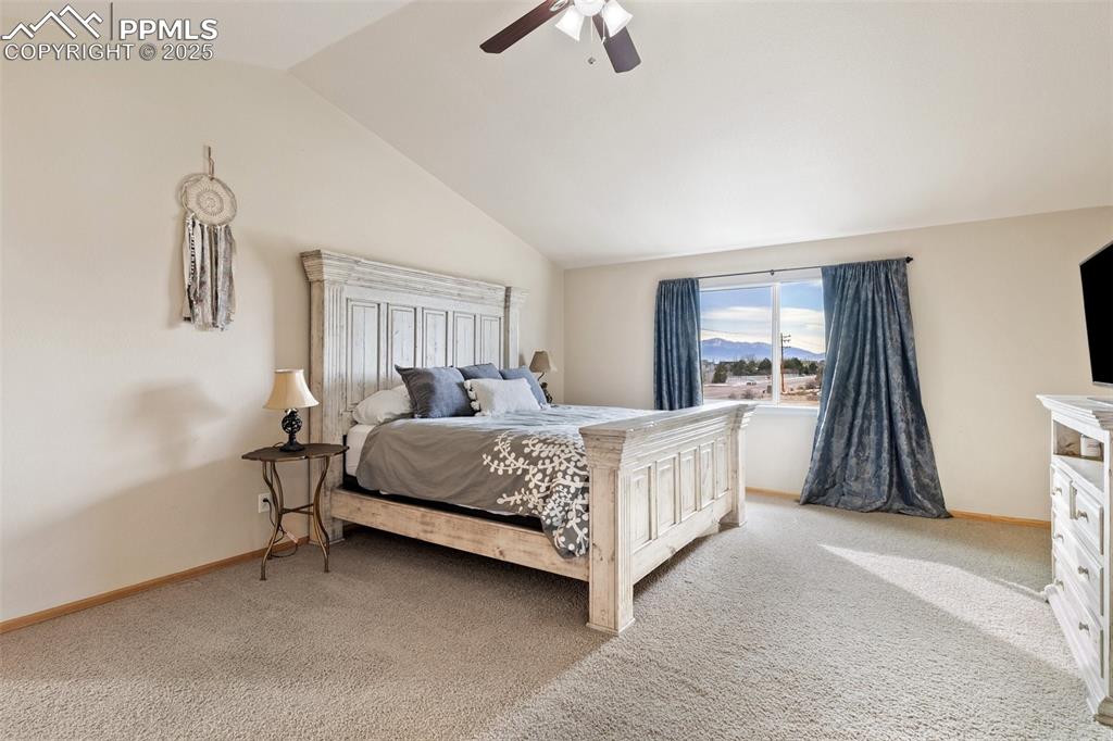 8518 Bohleen Road Peyton, CO 80831 - Photo 16 of 44 a bedroom with a bed and a window