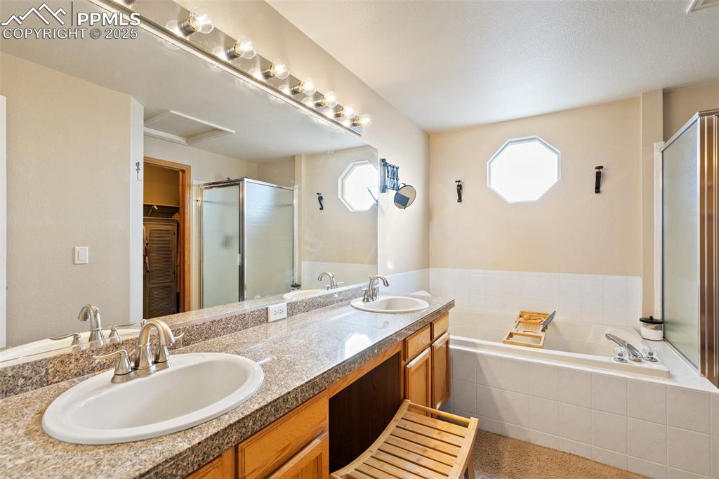 8518 Bohleen Road Peyton, CO 80831 - Photo 18 of 44 a bathroom with a sink and a mirror