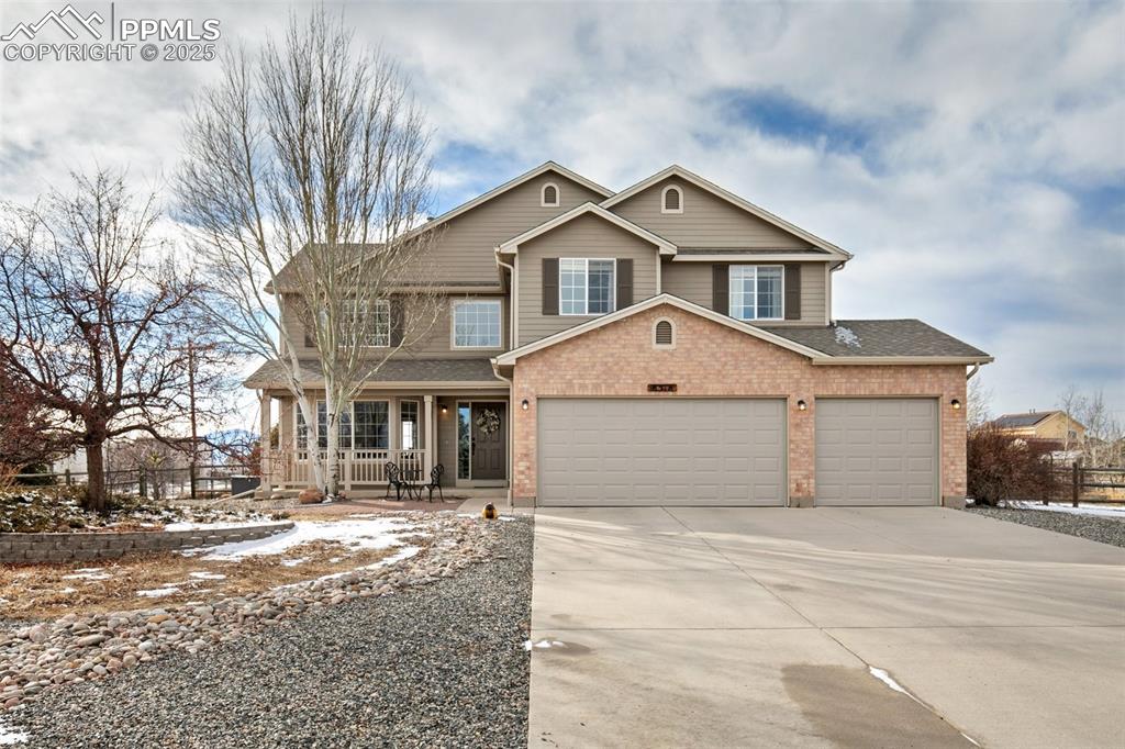 8518 Bohleen Road Peyton, CO 80831 - Photo 2 of 44 a front view of a house with a yard