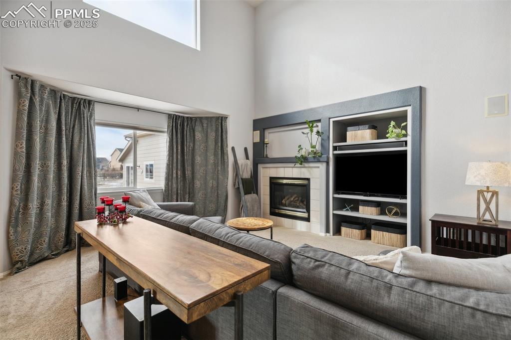 8518 Bohleen Road Peyton, CO 80831 - Photo 21 of 44 a living room with furniture and a flat screen tv