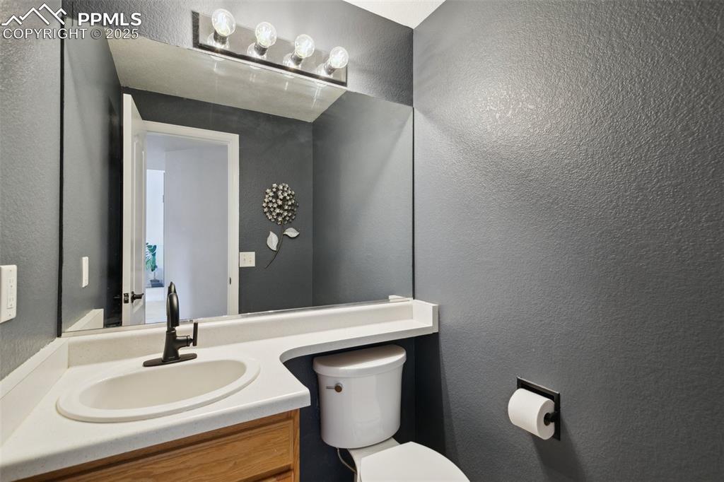 8518 Bohleen Road Peyton, CO 80831 - Photo 22 of 44 a bathroom with a sink and a toilet