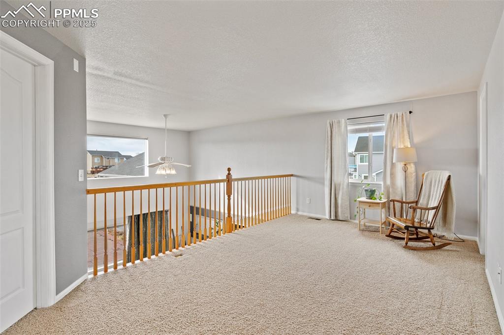 8518 Bohleen Road Peyton, CO 80831 - Photo 23 of 44 a view of a livingroom with furniture and a window