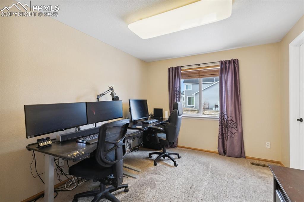 8518 Bohleen Road Peyton, CO 80831 - Photo 28 of 44 a view of workspace with a window