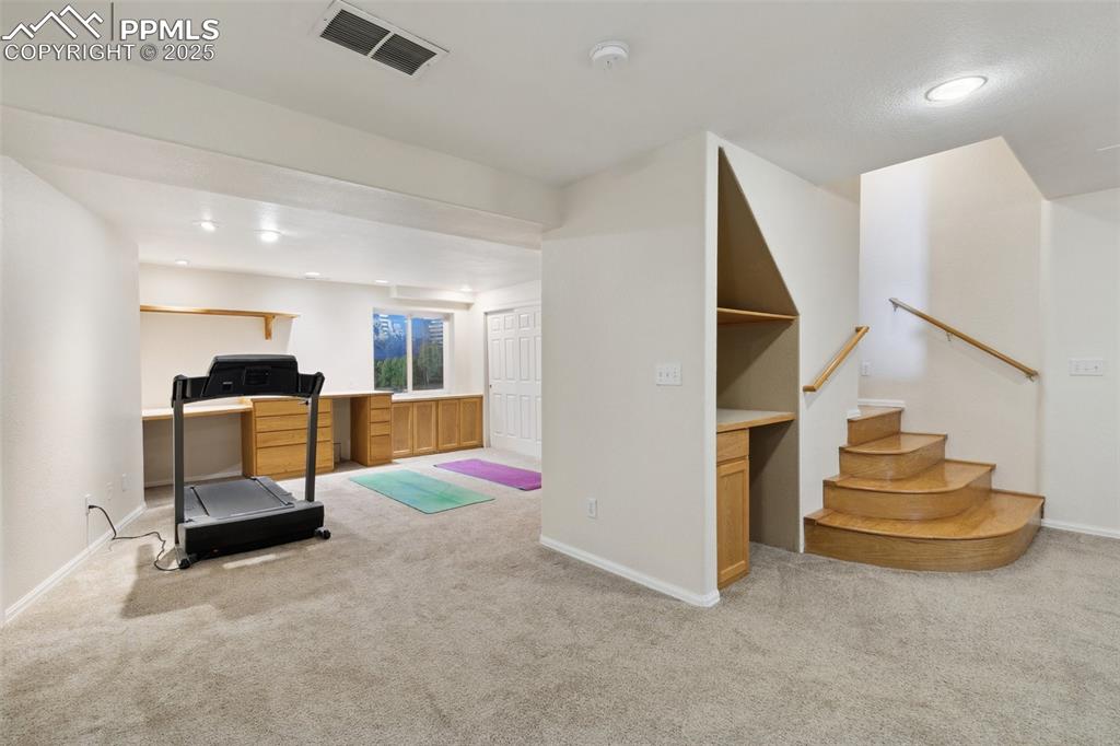 8518 Bohleen Road Peyton, CO 80831 - Photo 29 of 44 a view of entryway wih livingroom and stairs