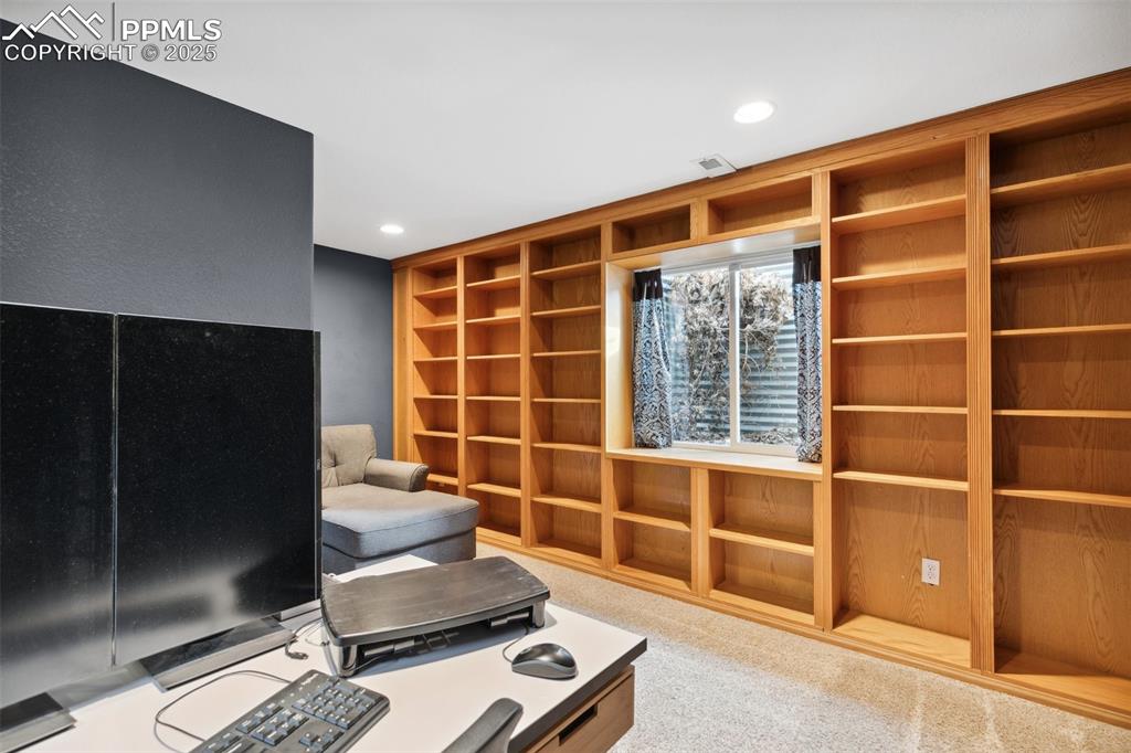 8518 Bohleen Road Peyton, CO 80831 - Photo 31 of 44 a room with furniture and a window