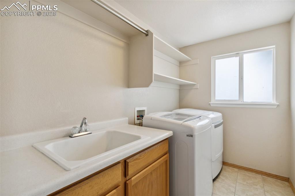 8518 Bohleen Road Peyton, CO 80831 - Photo 35 of 44 a utility room with dryer and washer