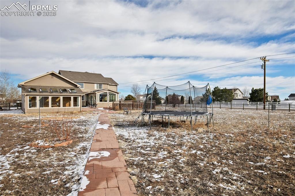 8518 Bohleen Road Peyton, CO 80831 - Photo 37 of 44 a front view of a house with a yard