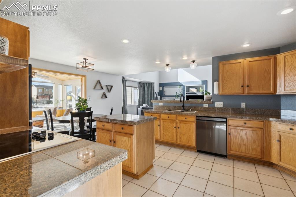 8518 Bohleen Road Peyton, CO 80831 - Photo 5 of 44 a large kitchen with stainless steel appliances lots of counter space and breakfast area
