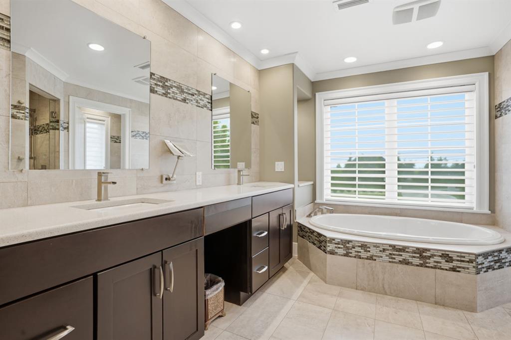 931 Pleasant Hill Road Wexford, PA 15090 - Photo 22 of 50 a spacious bathroom with a granite countertop tub sink and mirror