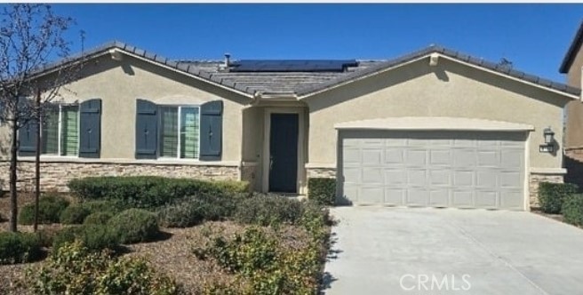 1701 Old Wagon Drive Hemet, CA 92545 - Photo 1 of 15 a front view of a house with a yard