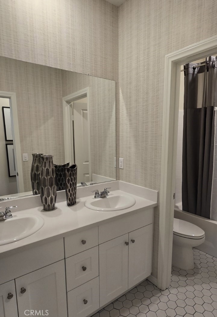 1701 Old Wagon Drive Hemet, CA 92545 - Photo 12 of 15 a bathroom with double sink and a mirror