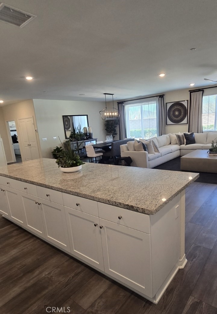1701 Old Wagon Drive Hemet, CA 92545 - Photo 3 of 15 a living room with furniture and a wooden floor