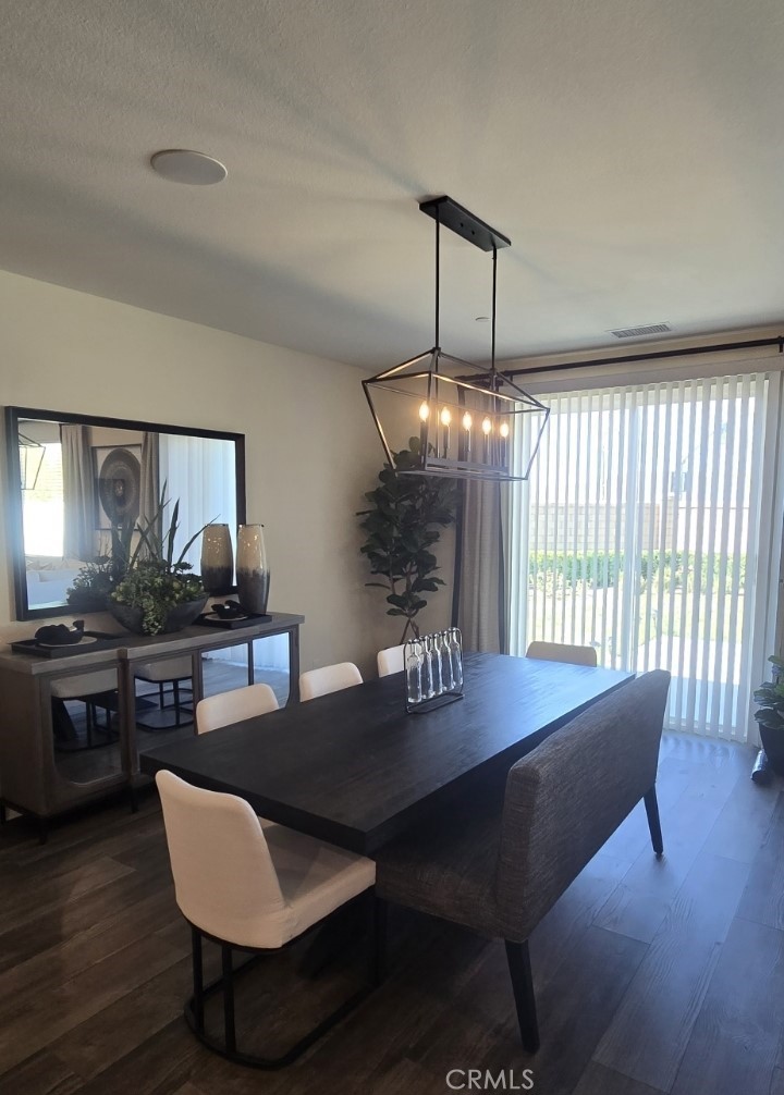 1701 Old Wagon Drive Hemet, CA 92545 - Photo 5 of 15 a view of a dining room with furniture window and wooden floor