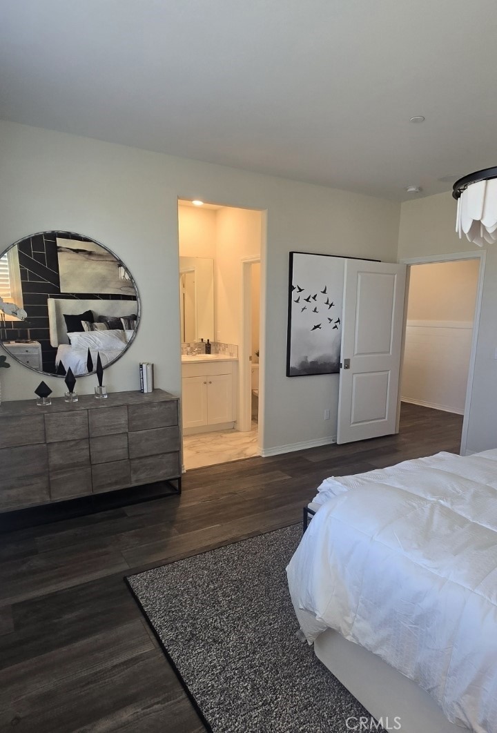 1701 Old Wagon Drive Hemet, CA 92545 - Photo 8 of 15 a bedroom with a bed and wooden floor