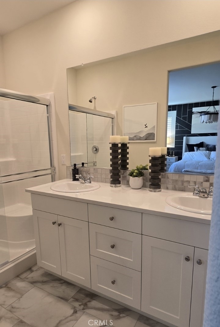 1701 Old Wagon Drive Hemet, CA 92545 - Photo 10 of 15 a bathroom with a double vanity sink and a