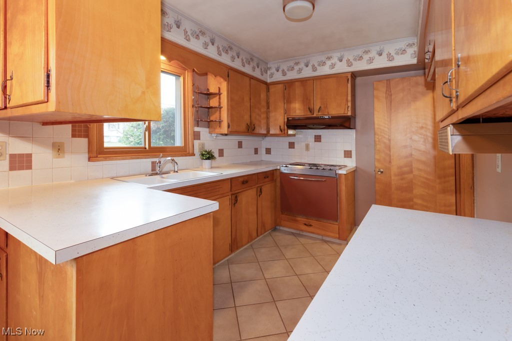 2837 Shellhart Road Barberton, OH 44203 - Photo 9 of 25 Original kitchen with ceramic tile flooring.