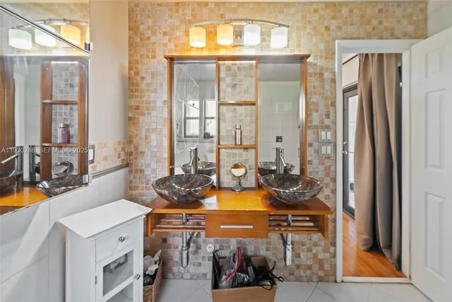 a bathroom with a toilet a sink and bathtub