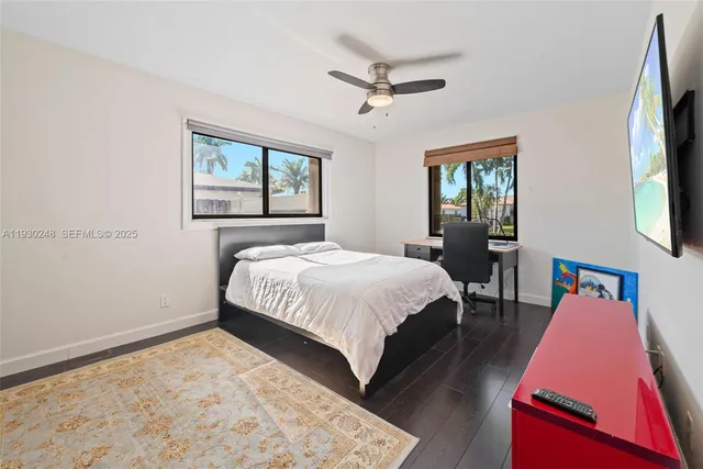 a view of a room with stairs and windows