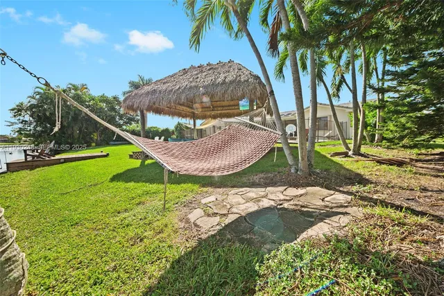 a view of a house with a yard porch and sitting area