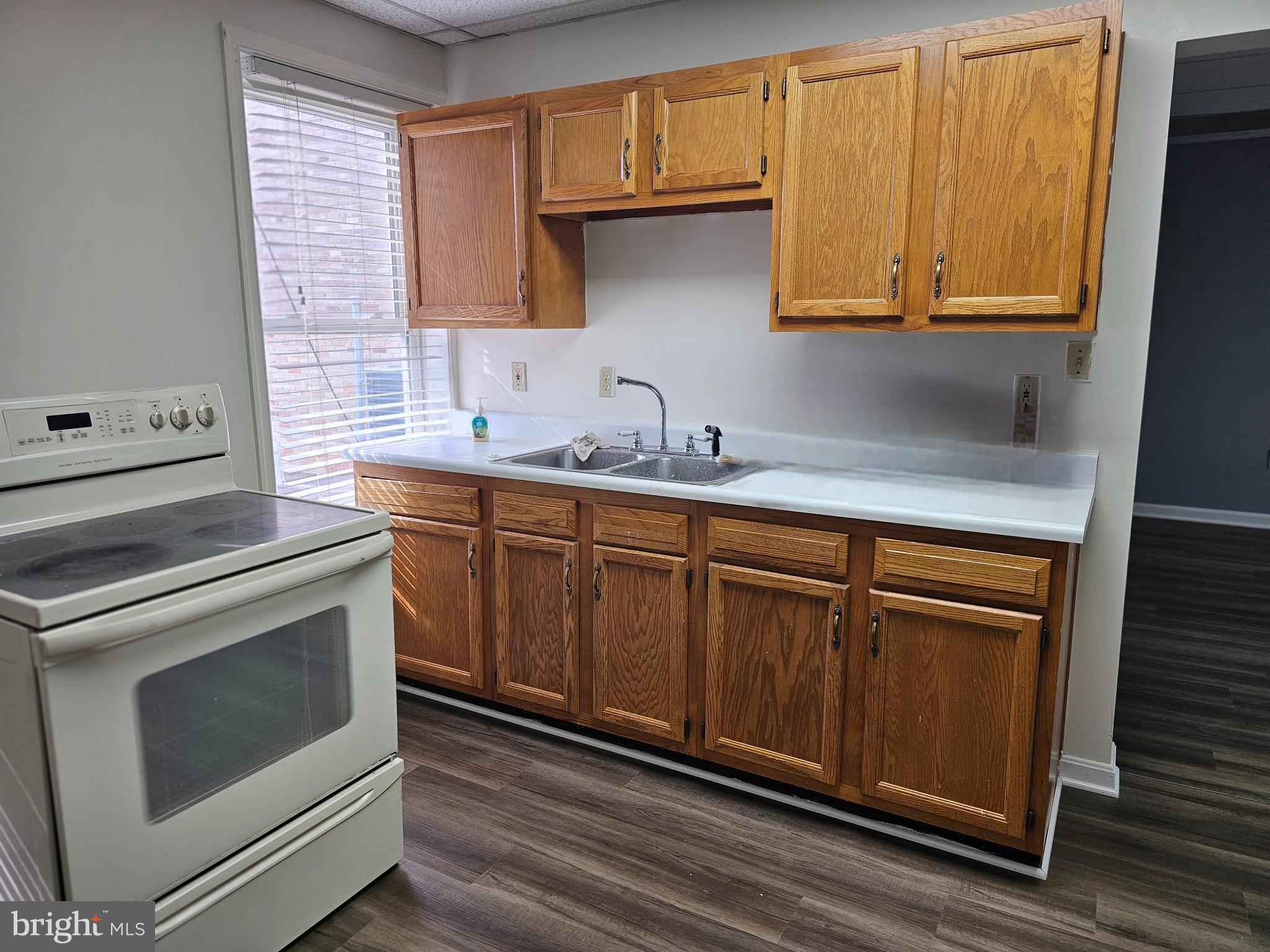 505 East Main Street, Unit 2 Front Royal, VA 22630 - Photo 2 of 9 a kitchen with stainless steel appliances granite countertop a sink a stove and cabinets