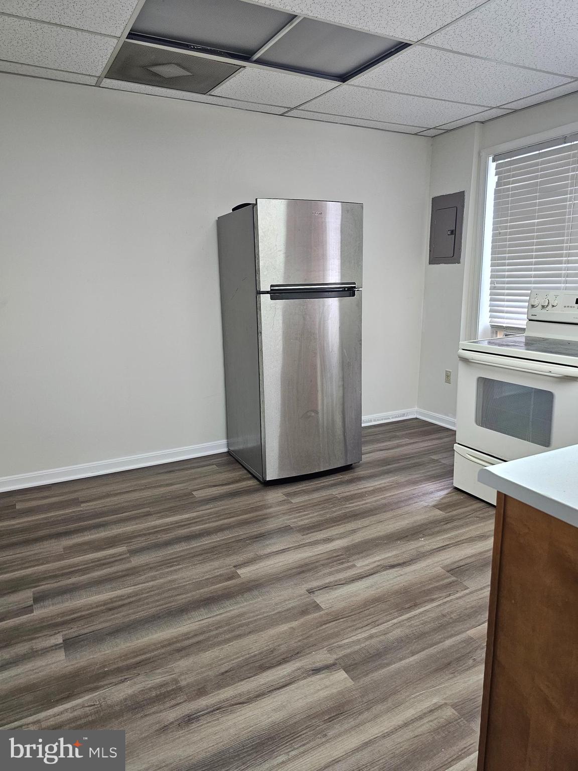 505 East Main Street, Unit 2 Front Royal, VA 22630 - Photo 3 of 9 a view of a refrigerator in kitchen and wooden floor