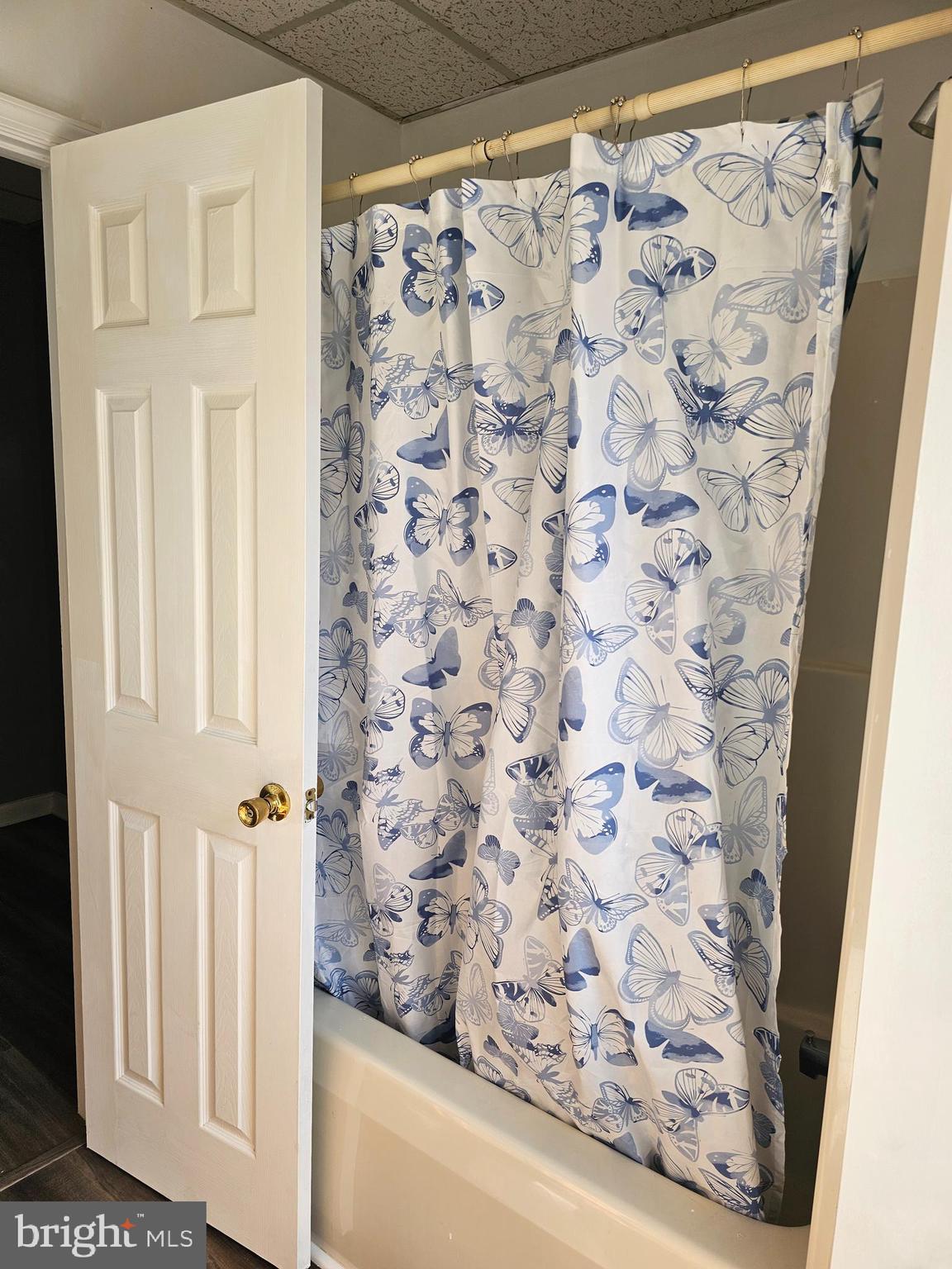 505 East Main Street, Unit 2 Front Royal, VA 22630 - Photo 8 of 9 a bathroom with a shower curtain