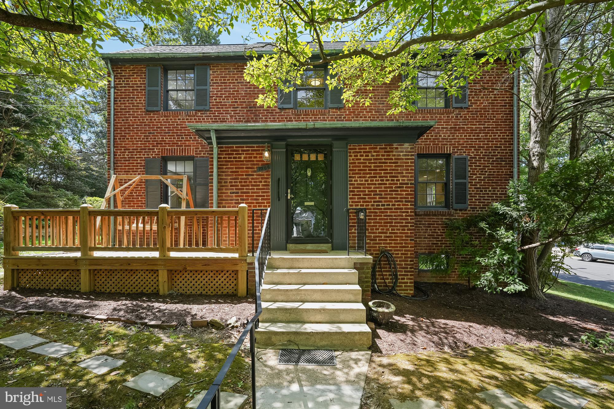 7206 Pinehurst Parkway Chevy Chase, MD 20815 - Photo 1 of 56 a view of a house with a small yard plants and large tree