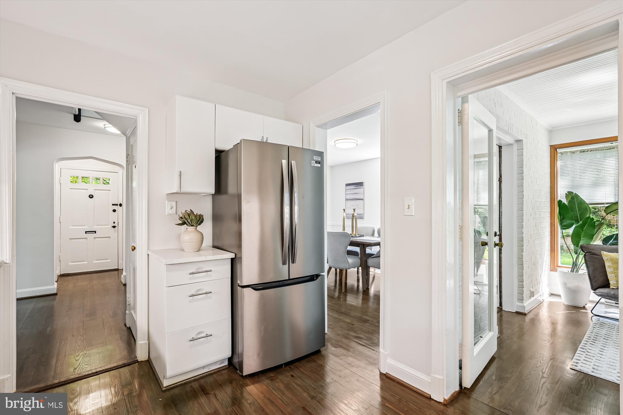 7206 Pinehurst Parkway Chevy Chase, MD 20815 - Photo 15 of 56 a kitchen with stainless steel appliances a refrigerator and a hard wood floor