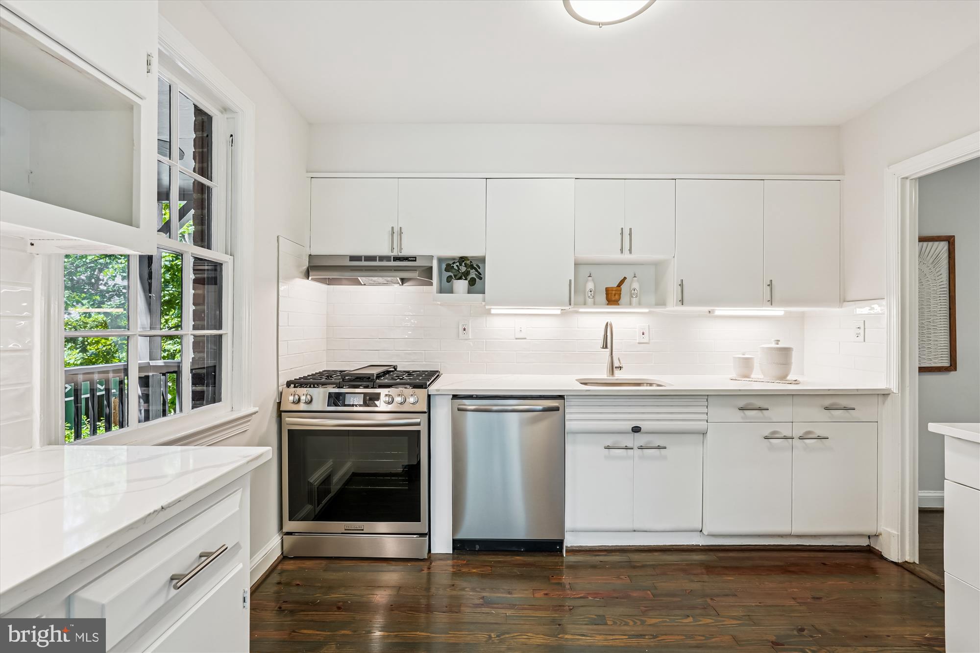 7206 Pinehurst Parkway Chevy Chase, MD 20815 - Photo 16 of 56 a kitchen with white cabinets and appliances