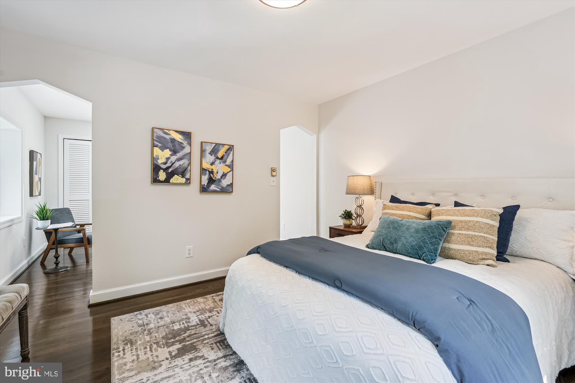 7206 Pinehurst Parkway Chevy Chase, MD 20815 - Photo 19 of 56 a bedroom with a bed and wooden floor