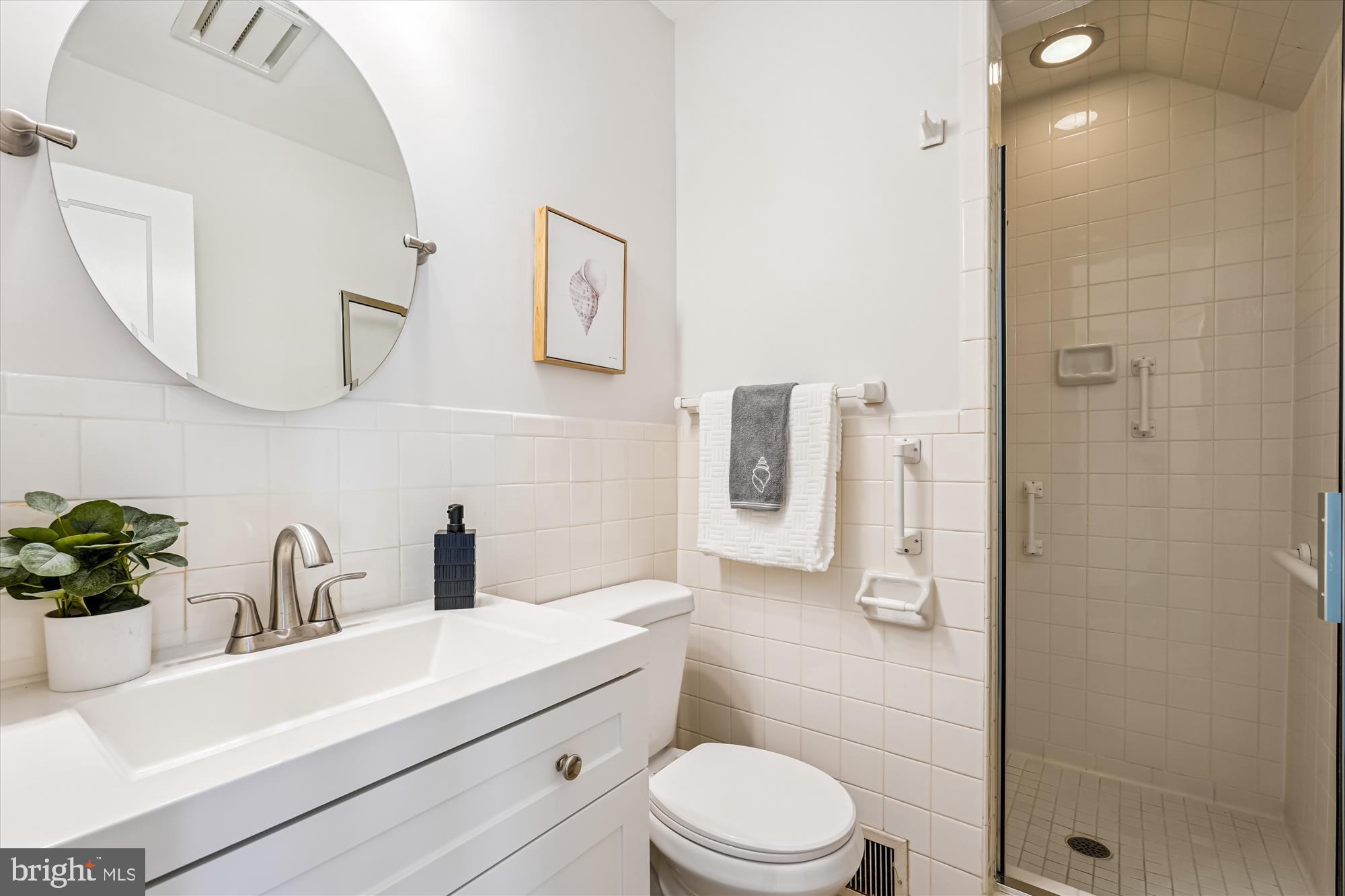 7206 Pinehurst Parkway Chevy Chase, MD 20815 - Photo 26 of 56 a bathroom with a sink a toilet and shower