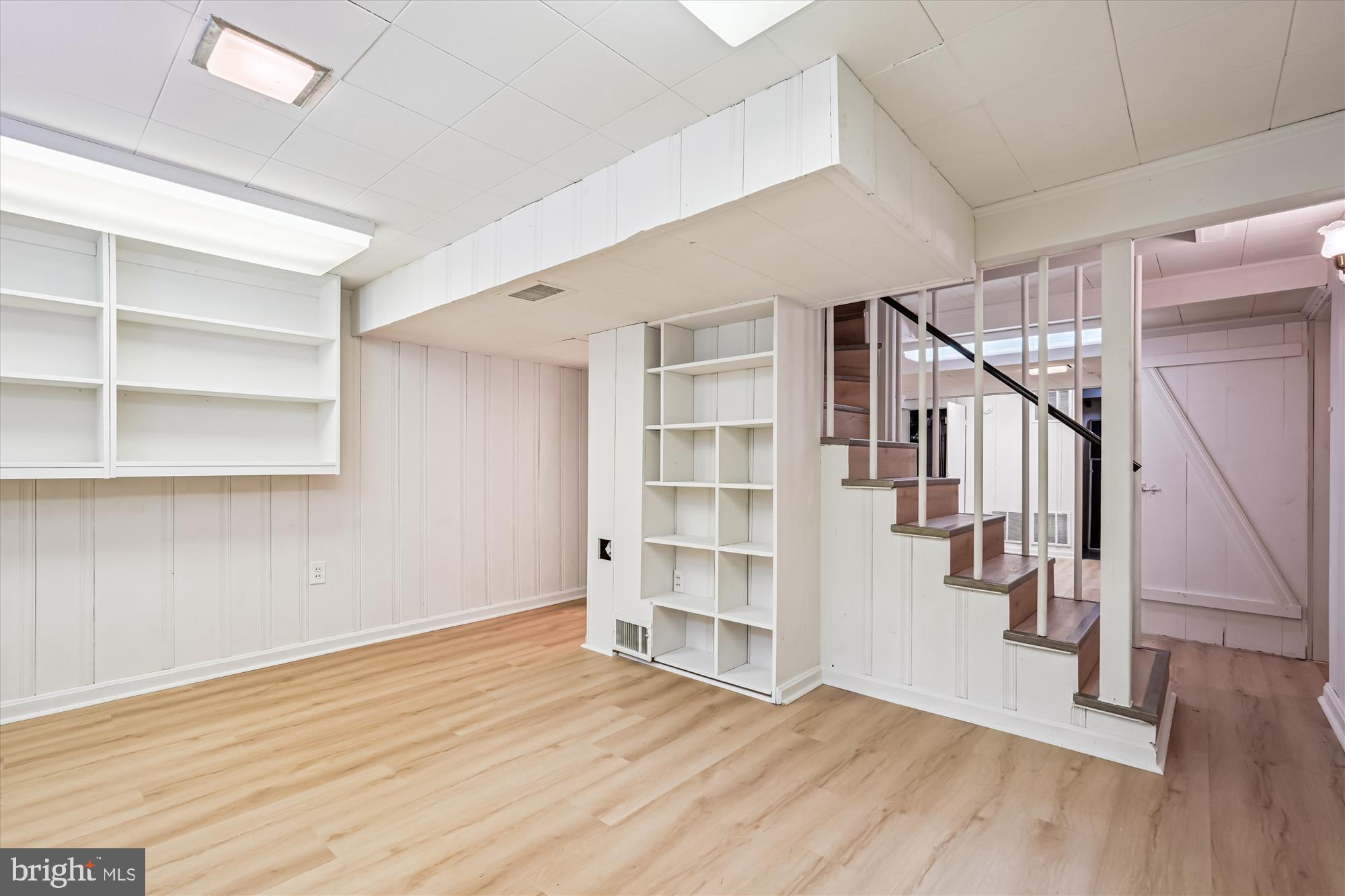 7206 Pinehurst Parkway Chevy Chase, MD 20815 - Photo 33 of 56 a view of room with stairs and wooden floor