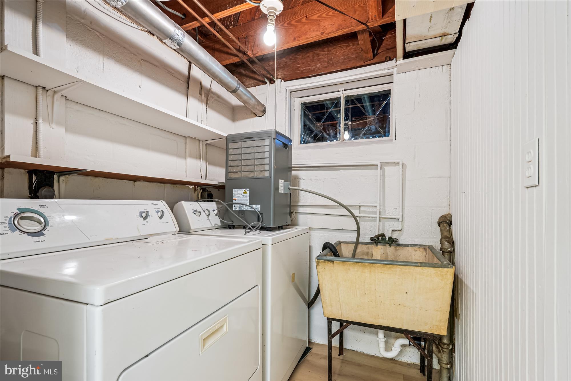 7206 Pinehurst Parkway Chevy Chase, MD 20815 - Photo 38 of 56 a utility room with dryer and washer