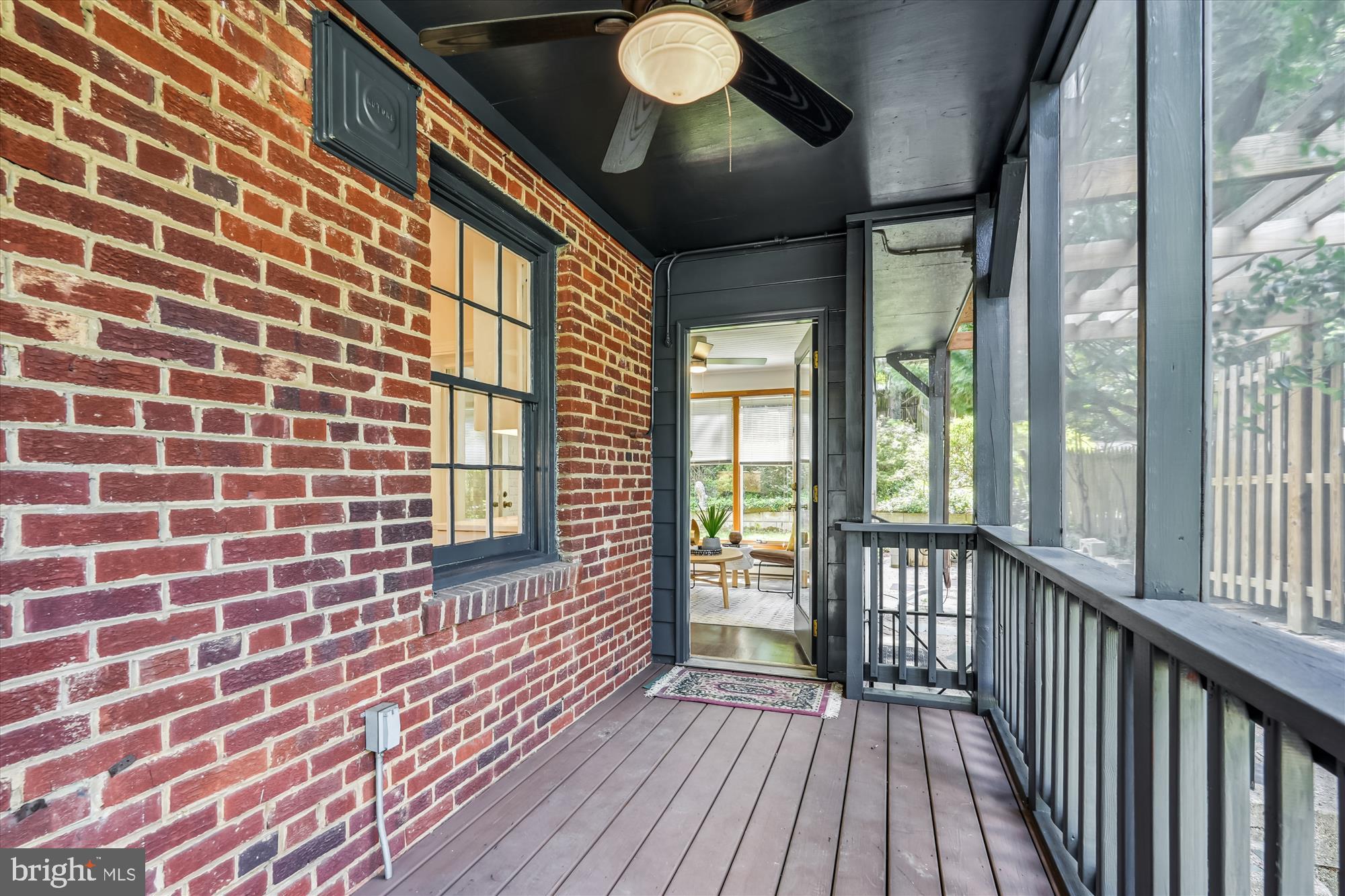 7206 Pinehurst Parkway Chevy Chase, MD 20815 - Photo 40 of 56 a view of a balcony with wooden floor and iron stairs
