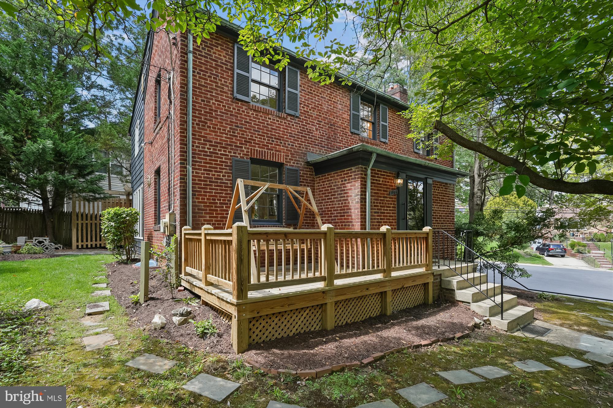 7206 Pinehurst Parkway Chevy Chase, MD 20815 - Photo 50 of 56 a view of a house with a yard