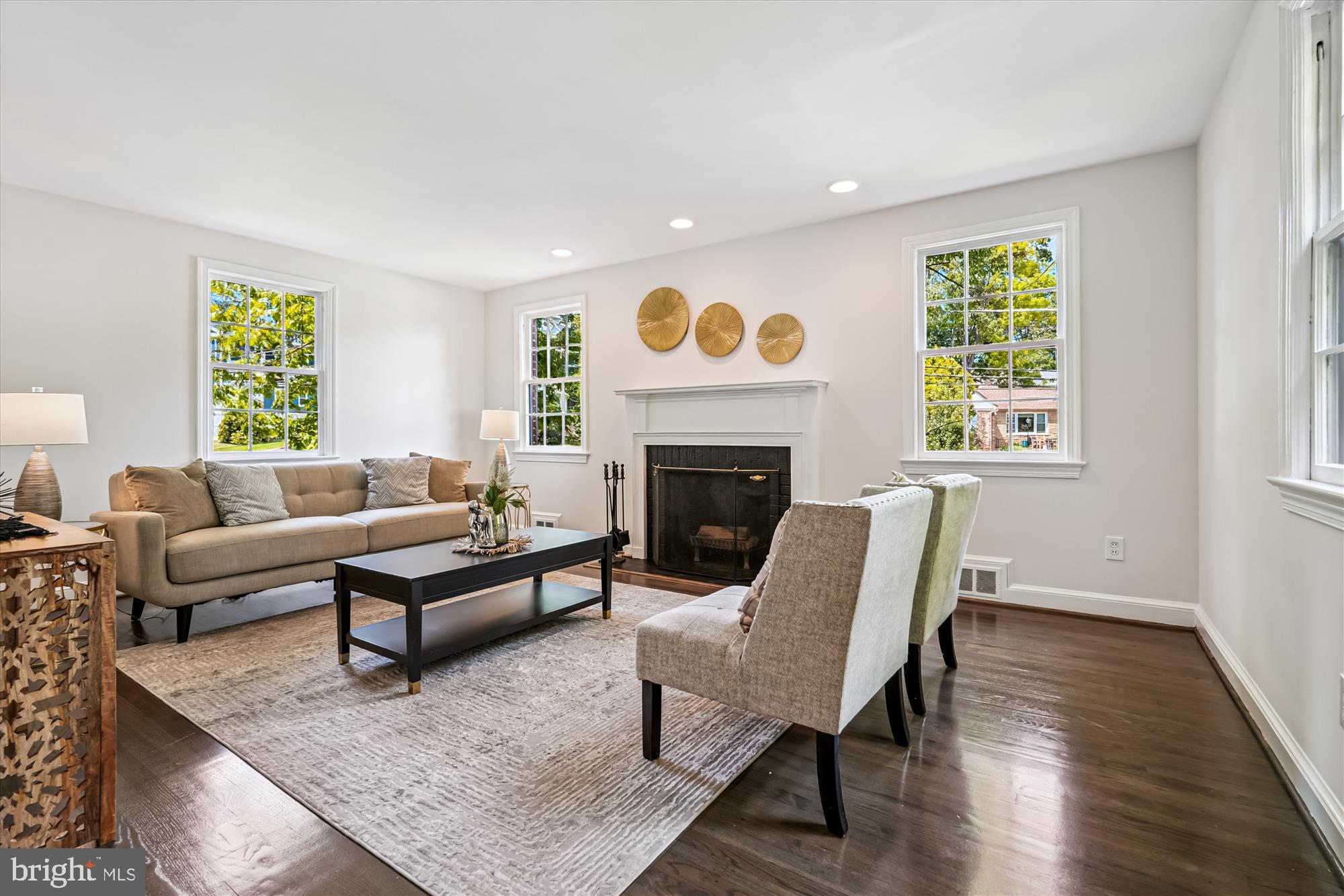7206 Pinehurst Parkway Chevy Chase, MD 20815 - Photo 6 of 56 a living room with furniture and a fireplace