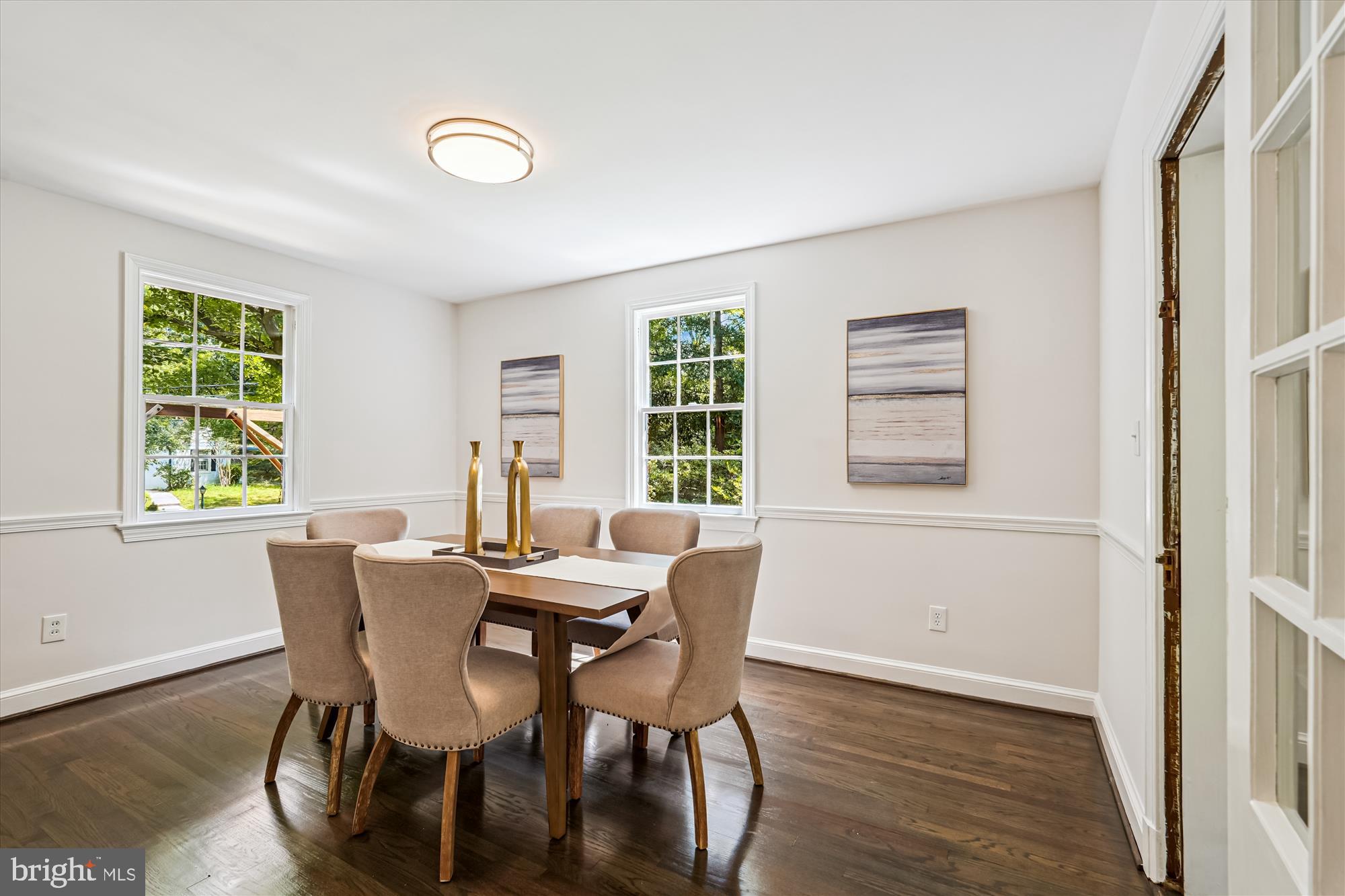 7206 Pinehurst Parkway Chevy Chase, MD 20815 - Photo 10 of 56 a view of a dining room with furniture windows and wooden floor