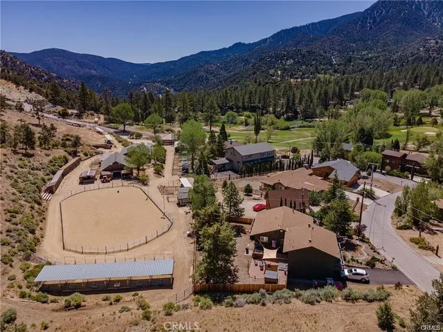 an aerial view of residential house and outdoor space