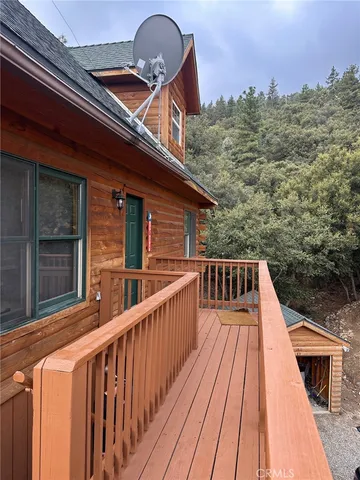 a view of balcony with wooden floor and city view